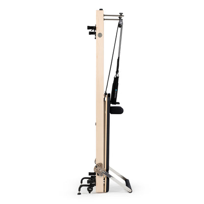 Vertical Pilates reformer in home studio setting